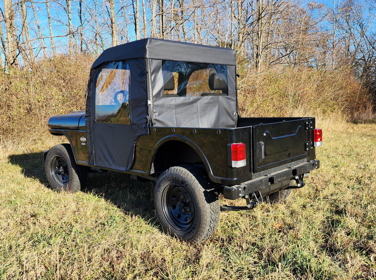 Rear three-quarter view of the 3 Star cab enclosure rear window and doors on a black Mahindra Roxor