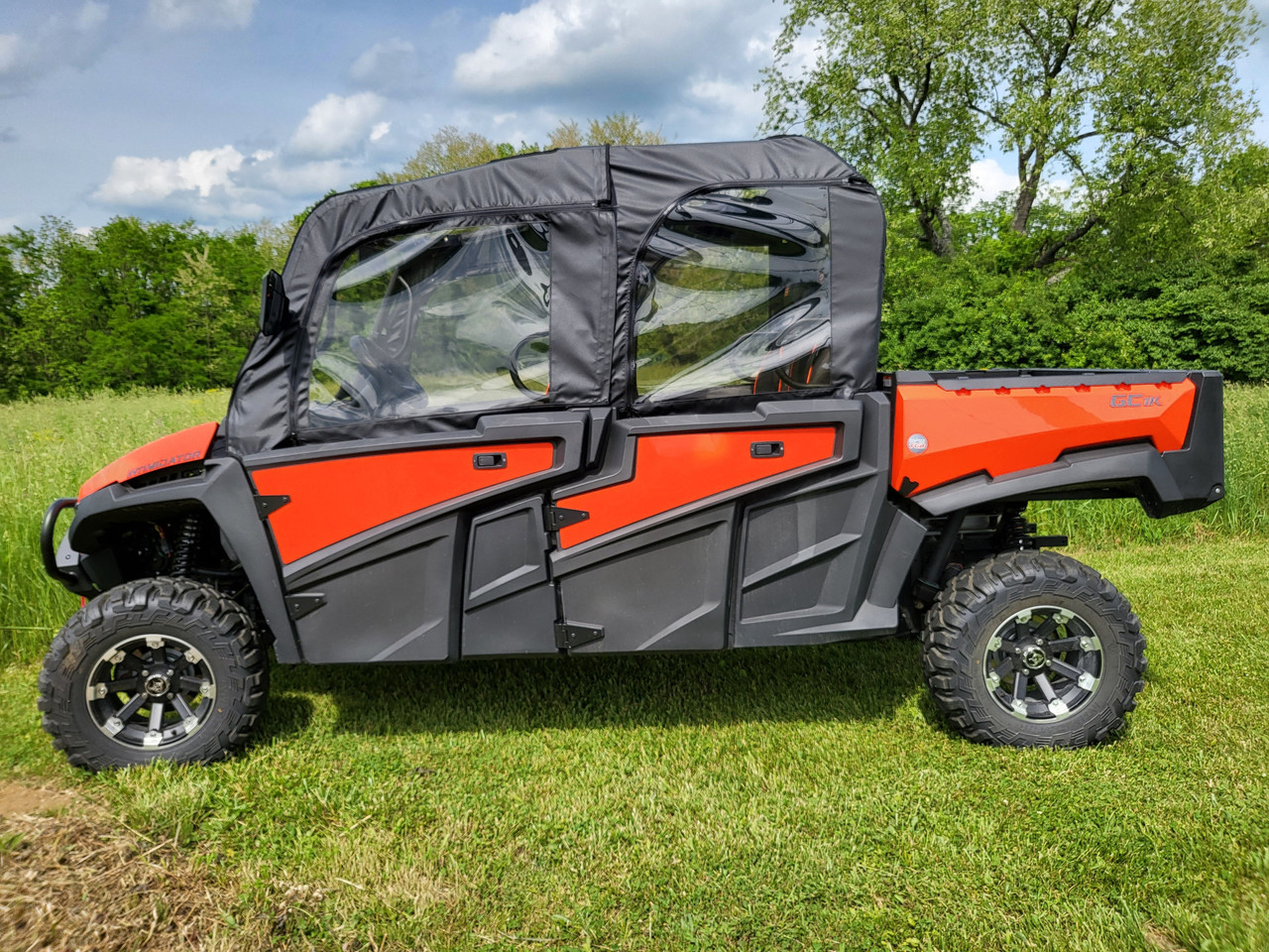 3 Star upper doors and rear window combo on an orange Intimidator GC1K 6-seater, driver side view