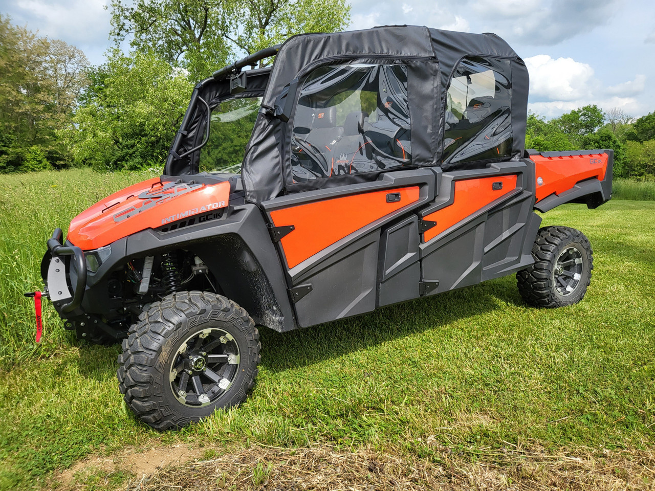 Front three-quarter view of an orange Intimidator GC1K 6-seater with the 3 Star upper doors installed