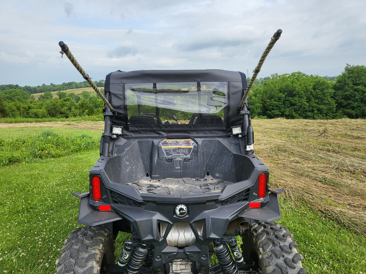 Straight rear view of the 3 Star clear rear window above the bed of a Can-Am Maverick Sport Max