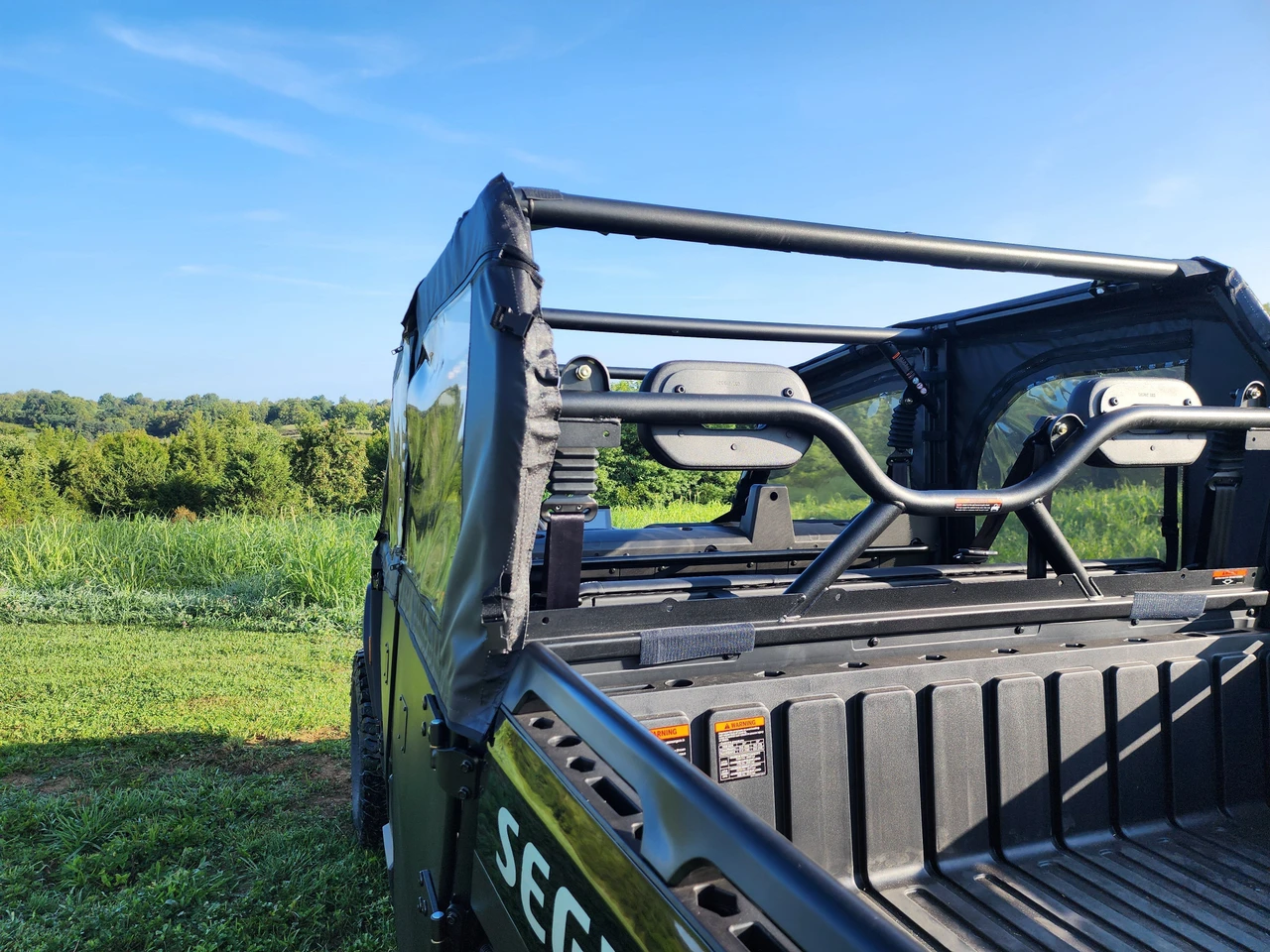 Angled view from the Segway UT10 Crew bed showing the 3 Star full door with clear window on the driver side
