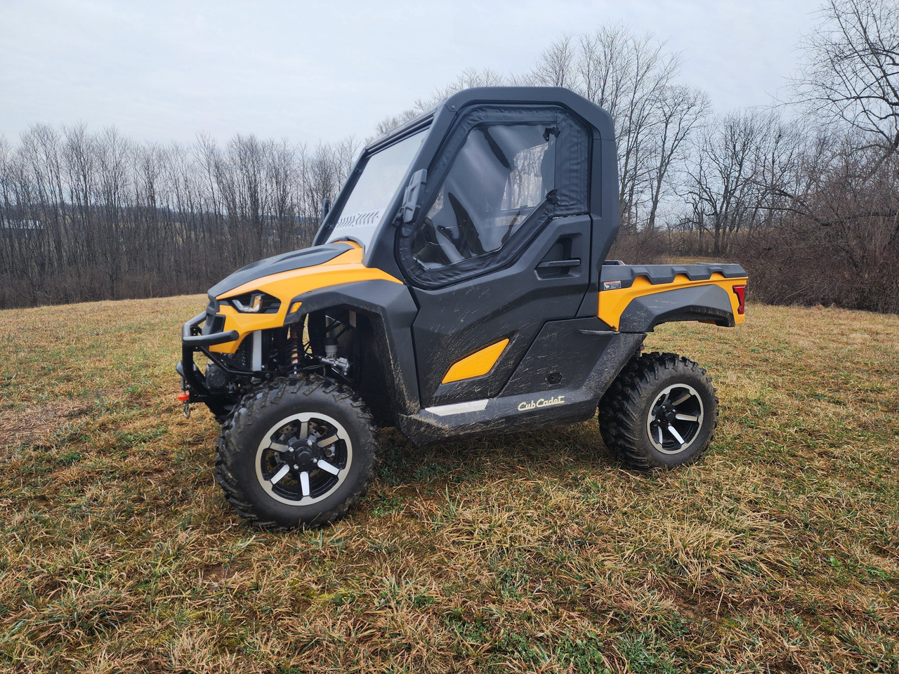 Front three-quarter view of the 3 Star framed upper doors on a yellow Cub Cadet Challenger MX
