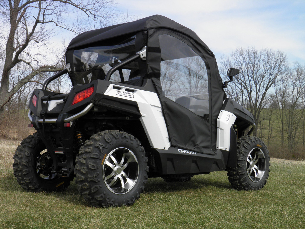 3 Star full cab enclosure installed on a white CFMoto ZForce 600 with hard windshield, rear three-quarter view