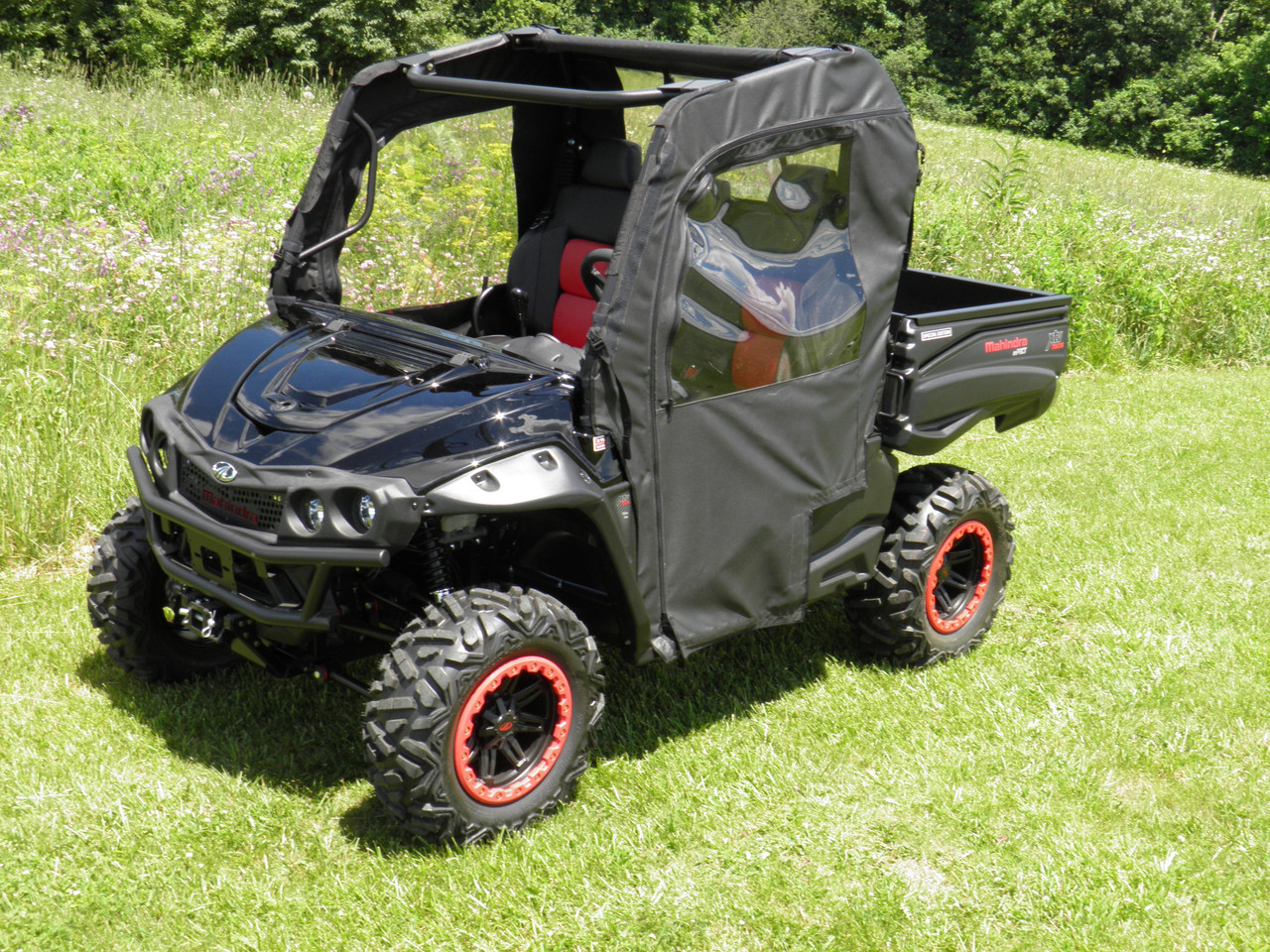 3 Star door and rear window combo on a black Mahindra 750, front three-quarter view in a field