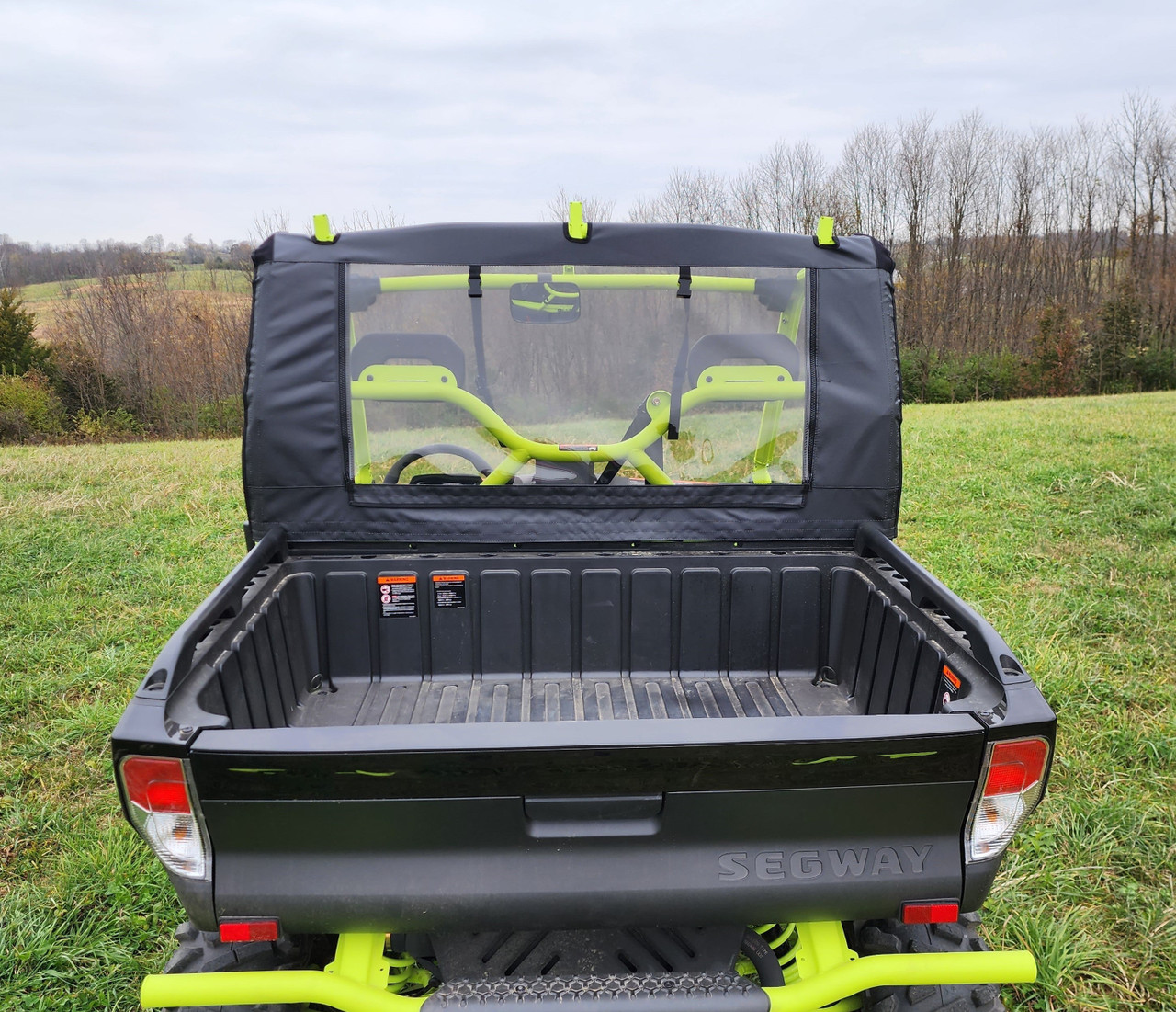 Rear view of a black Segway UT10 showing the 3 Star rear window panel with clear vinyl above the cargo bed