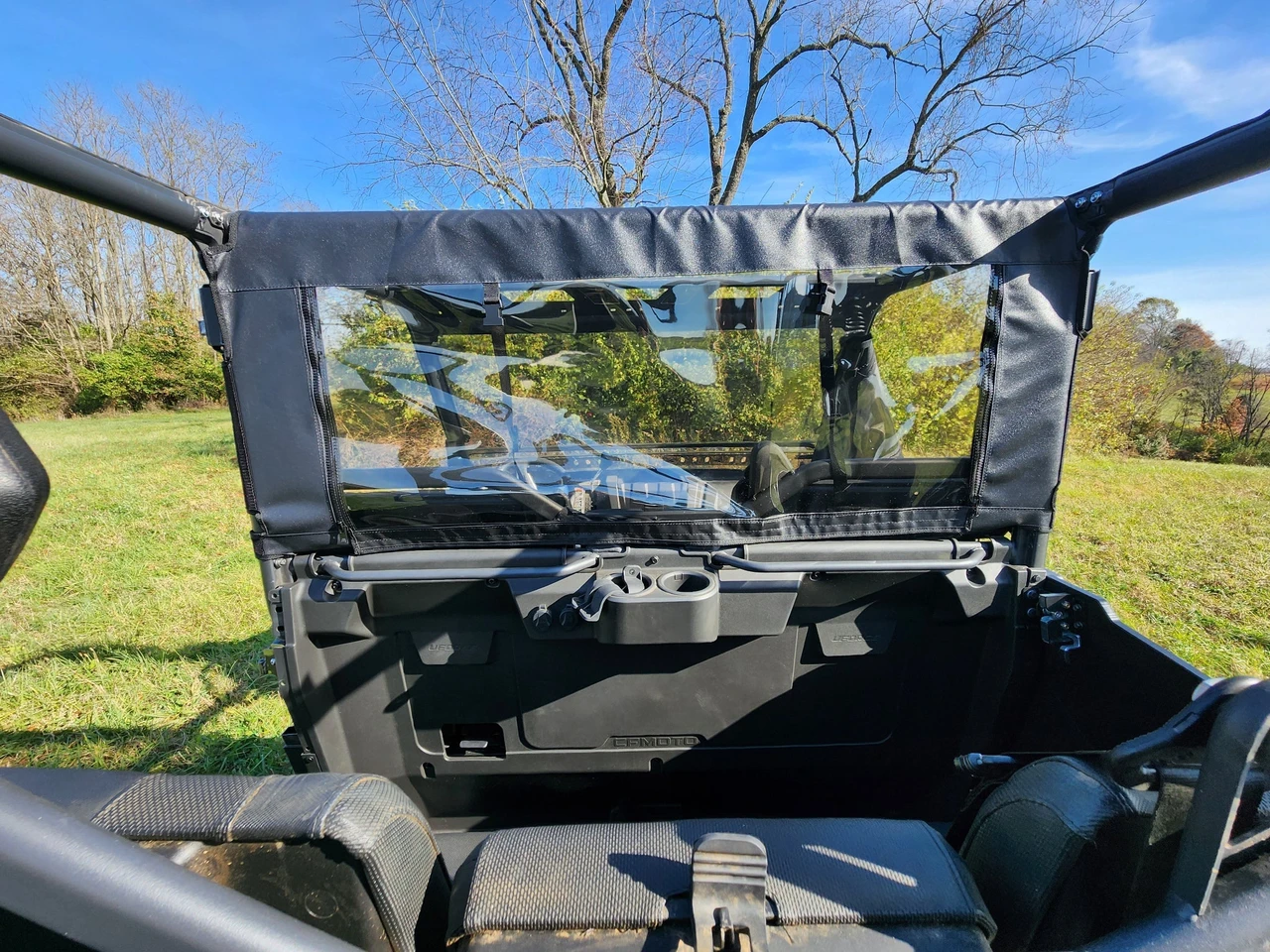 Inside view of the 3 Star rear panel with clear window behind the seats of a CFMoto UForce 1000