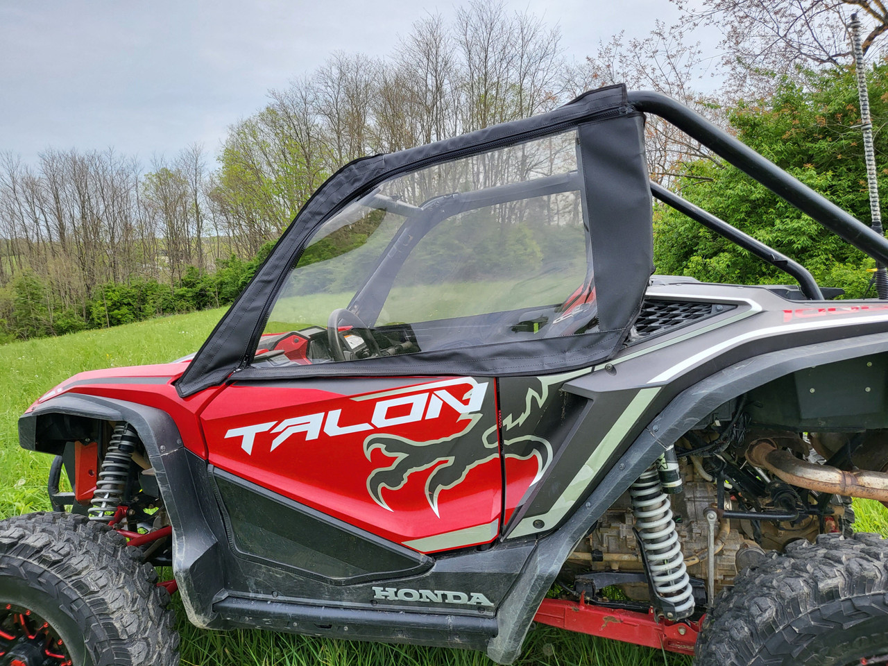 Close driver side view of the 3 Star upper door with clear window on the red Honda Talon 2-seater