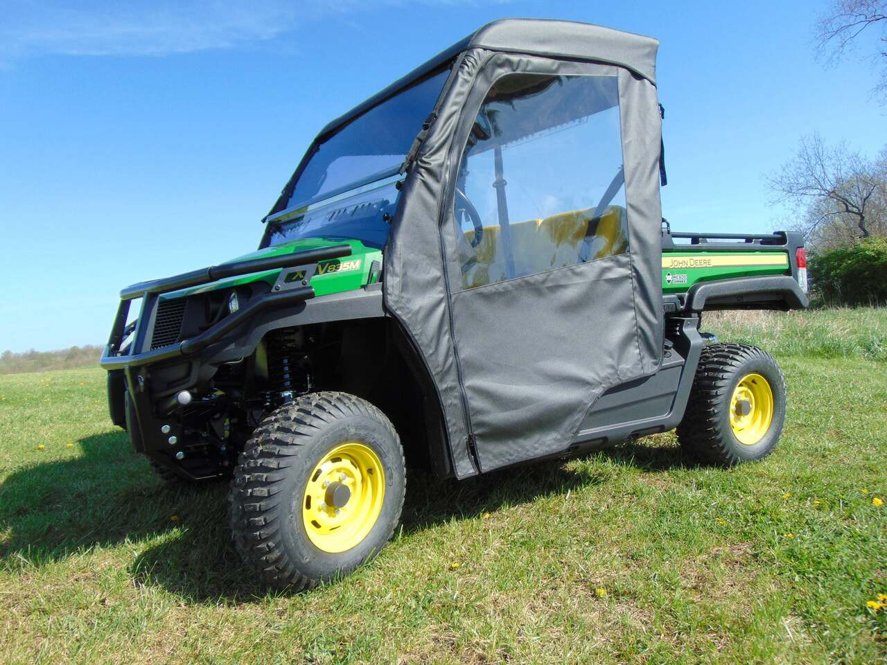 3 Star full heavy-duty canvas doors on a green John Deere Gator 835, driver side front three-quarter view in a field