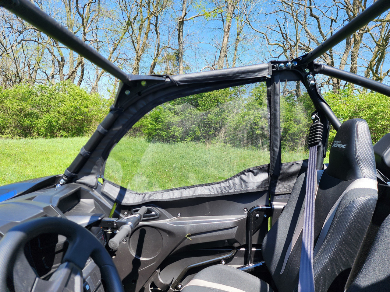 Inside view of the 3 Star mesh window upper door from the driver seat of a Kawasaki Teryx KRX