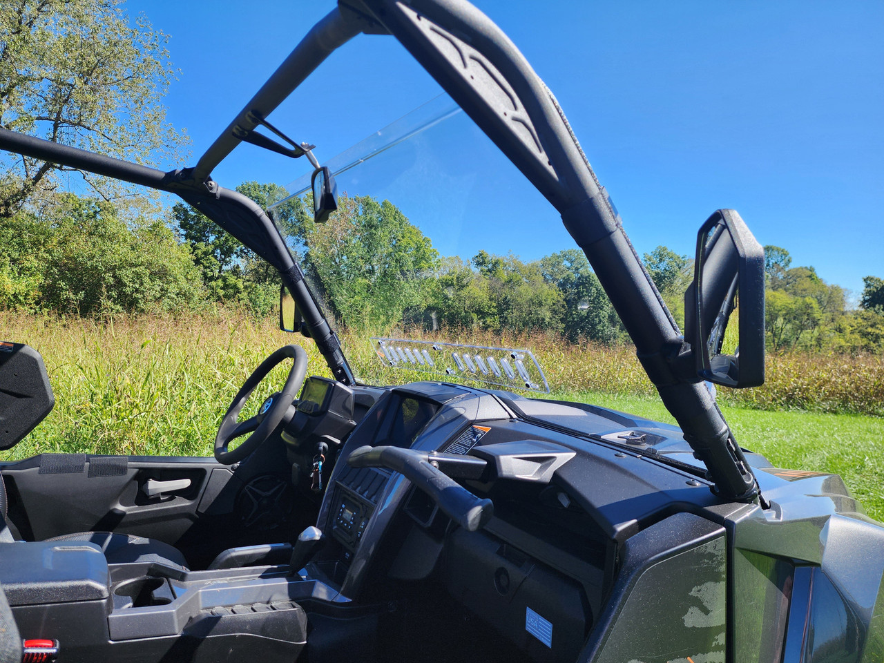 View from inside the cab of the 3 Star one-piece windshield on a Yamaha Wolverine RMAX 4-1000 cage
