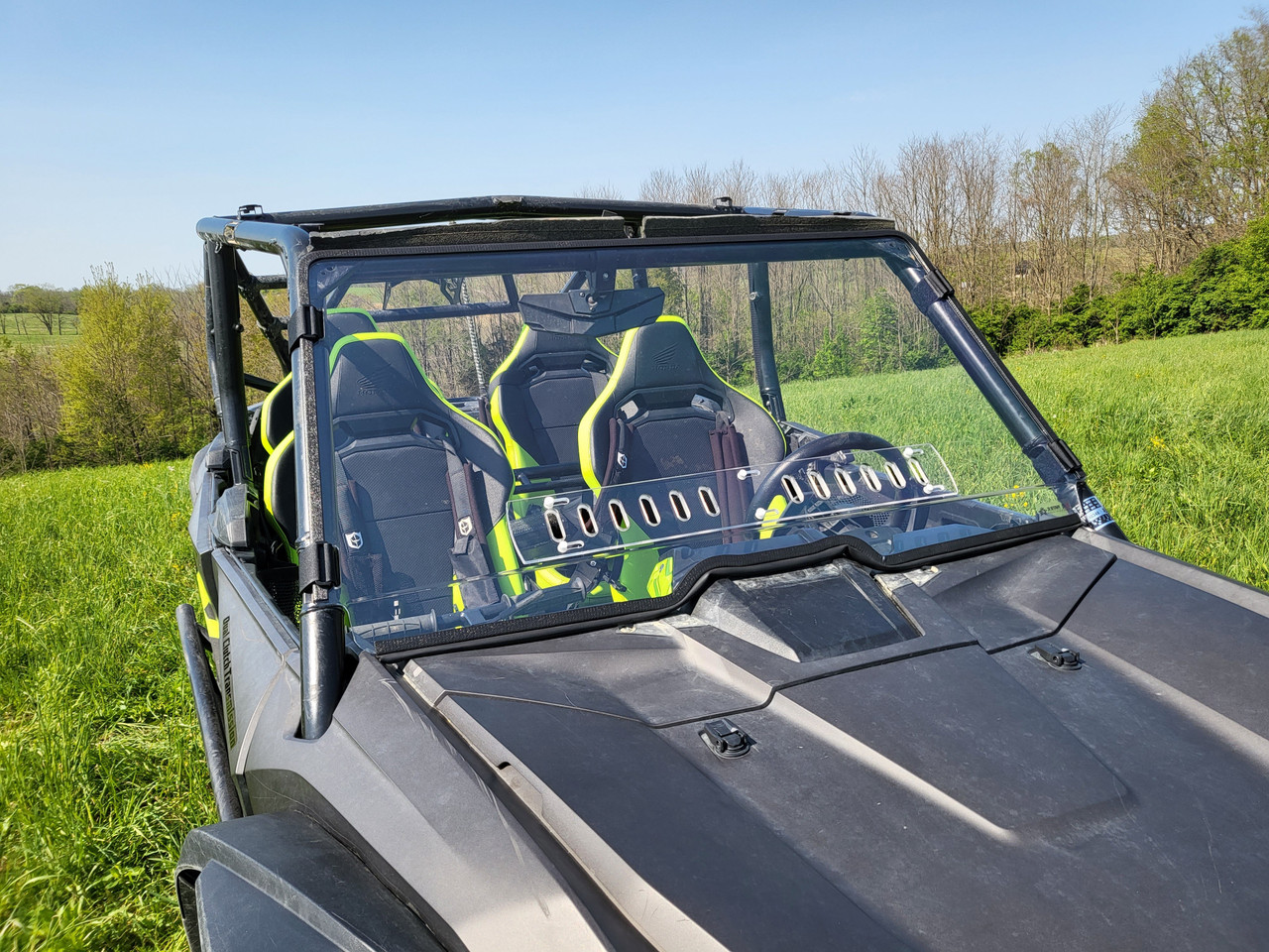 3 Star 1-piece windshield on a black Honda Talon 4-seater with green seats, front three-quarter view