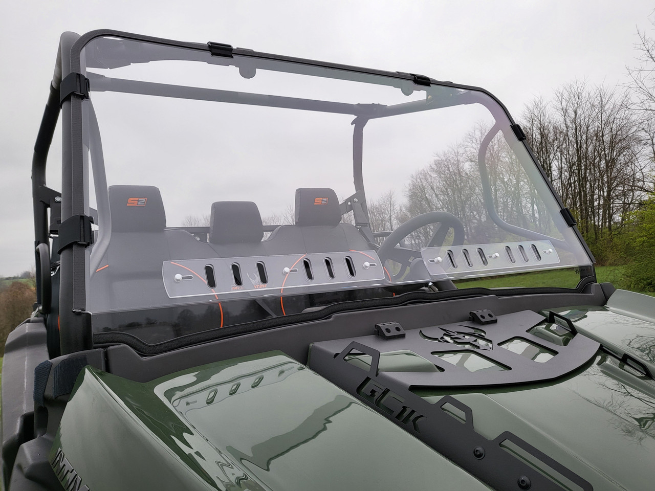 3 Star 1-piece windshield on a green Intimidator GC1K 3-seater, front view over the hood showing the vents