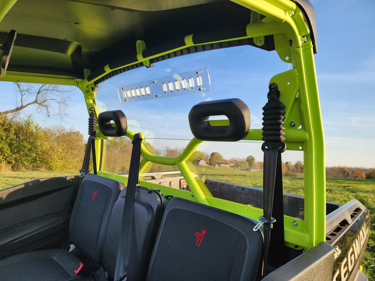 3 Star 1-piece Lexan back panel with vent slots behind the seats of a lime green Segway UT10, inside view
