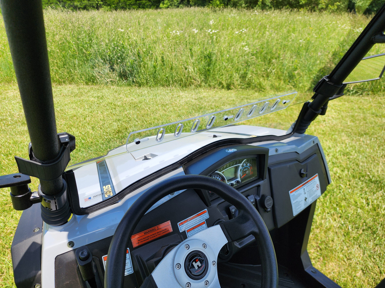 View from the driver seat of the 3 Star one-piece windshield with vent strip on a HiSun Sector 250