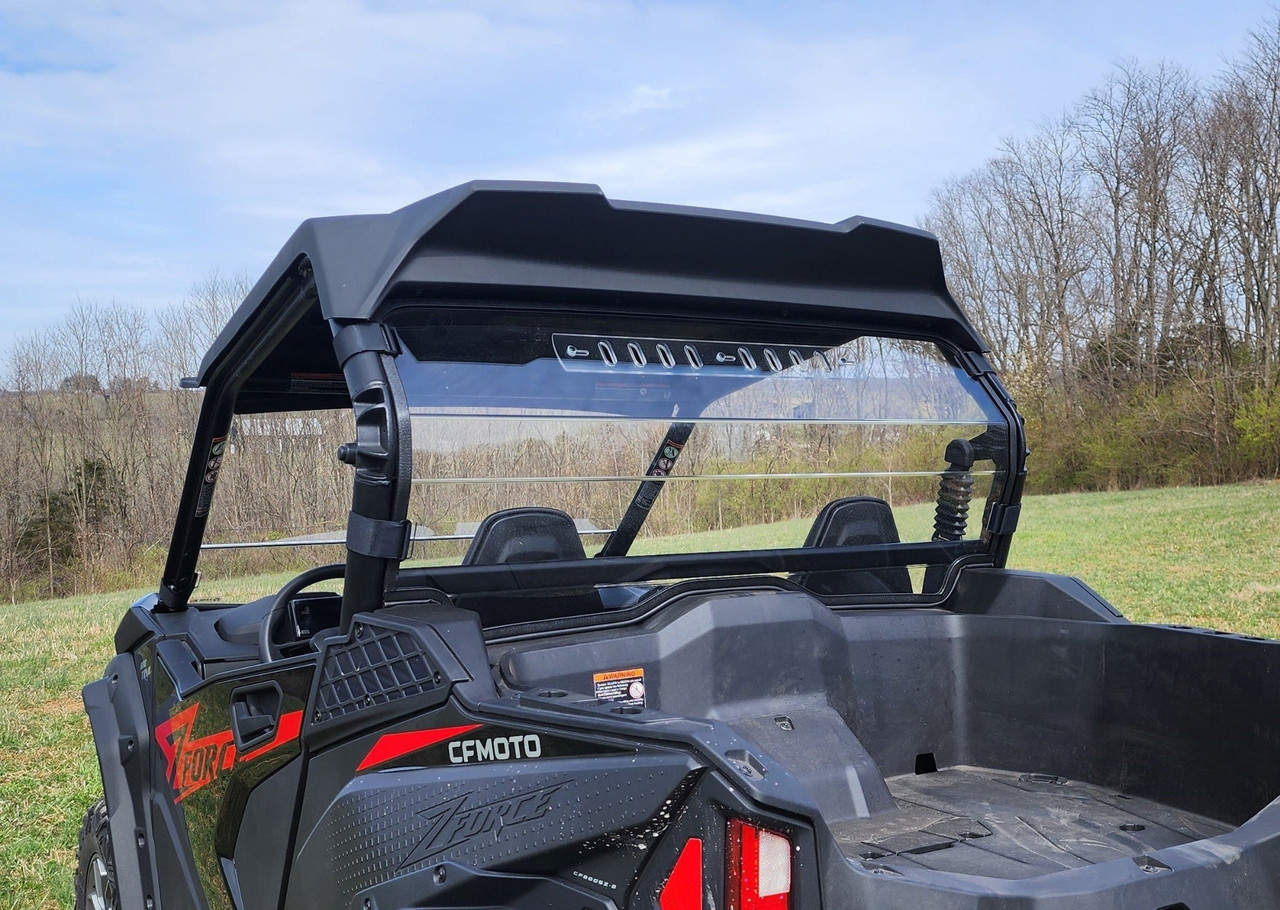 3 Star one-piece Lexan back panel installed behind the seats of a black CFMoto ZForce 950, rear three-quarter view