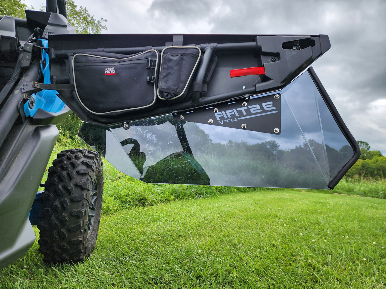 Can-Am Maverick X3 door swung open showing the inside of the 3 Star tinted lower door insert and door bag