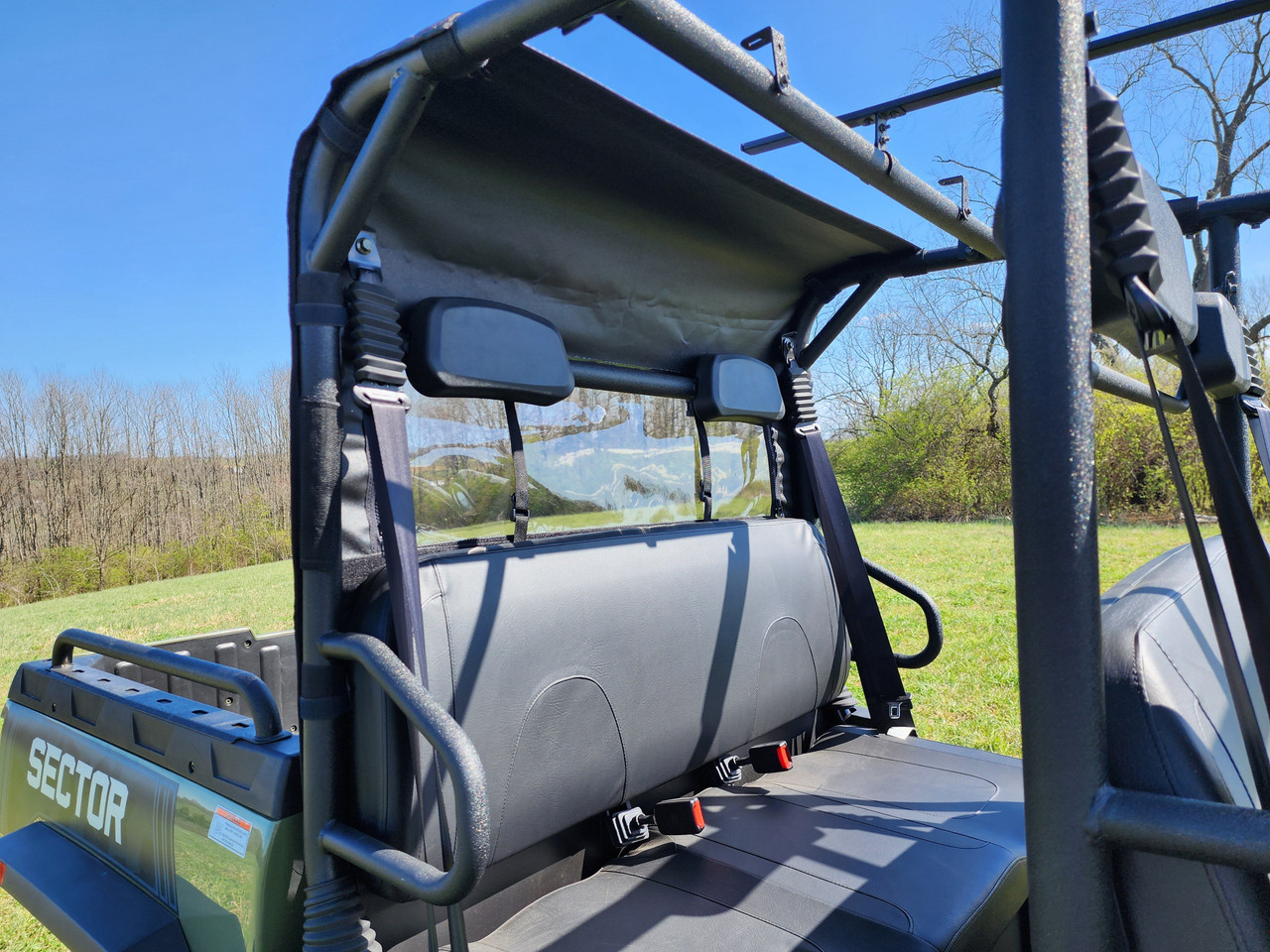 3 Star soft back panel on a HiSun Sector 1000 Crew viewed from the bed, clear vinyl window behind the rear seat