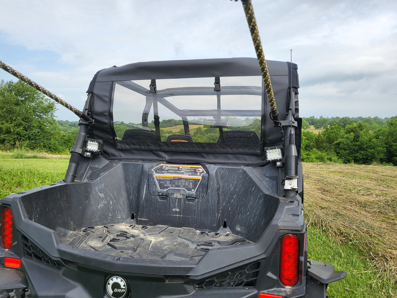 3 Star canvas rear panel viewed over the rear cargo box of a Can-Am Maverick Trail, angled rear view