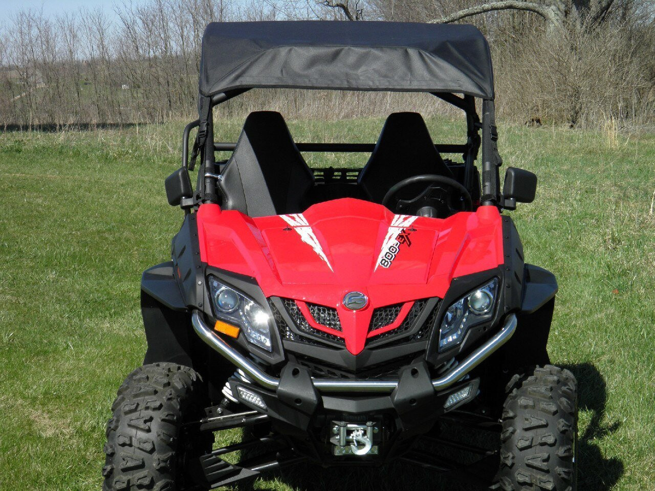 3 Star soft top for a hard windshield on a red CFMoto ZForce, straight front view on grass