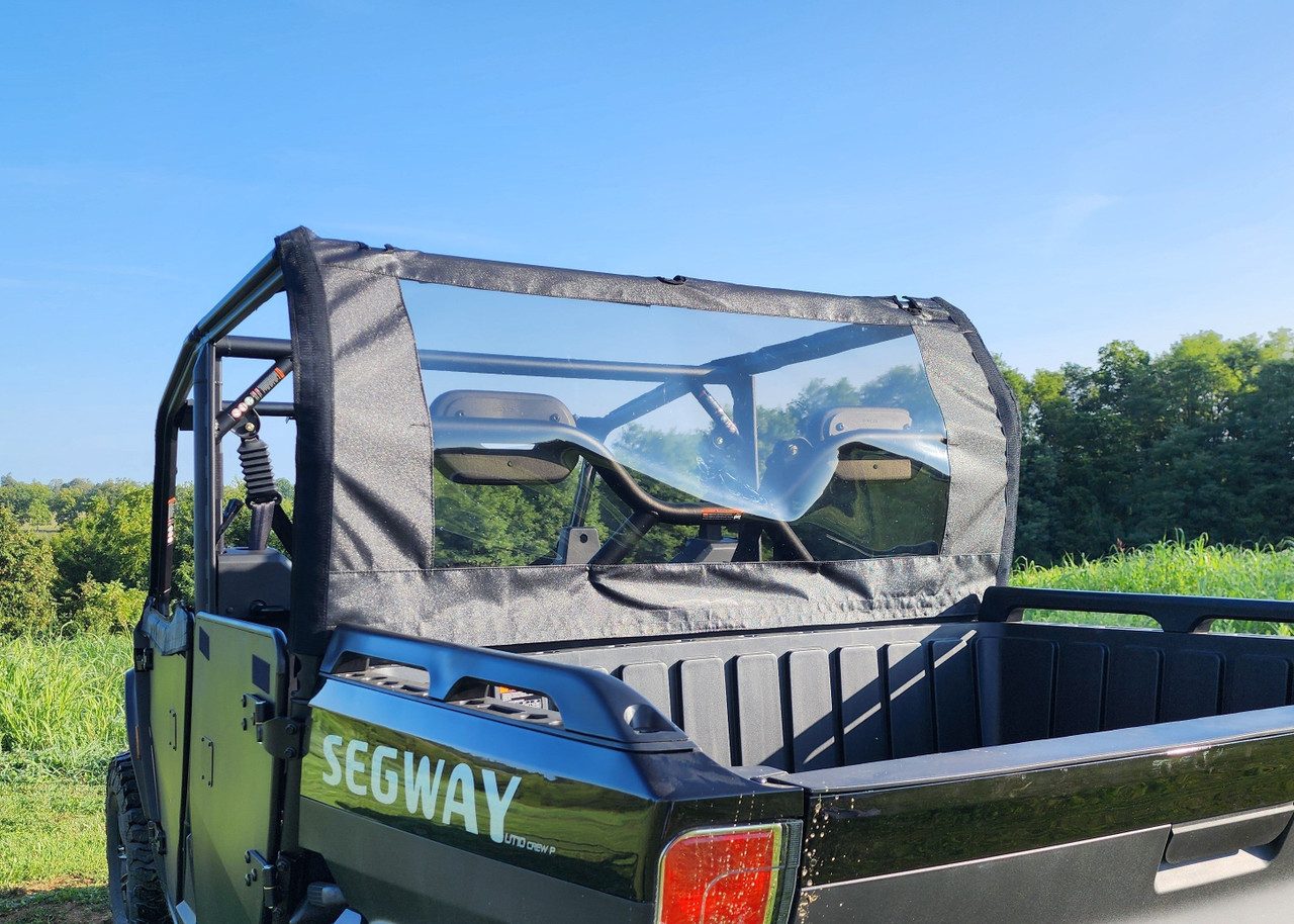 3 Star canvas back panel with clear window behind the cab of a green Segway UT10 Crew, seen from the bed