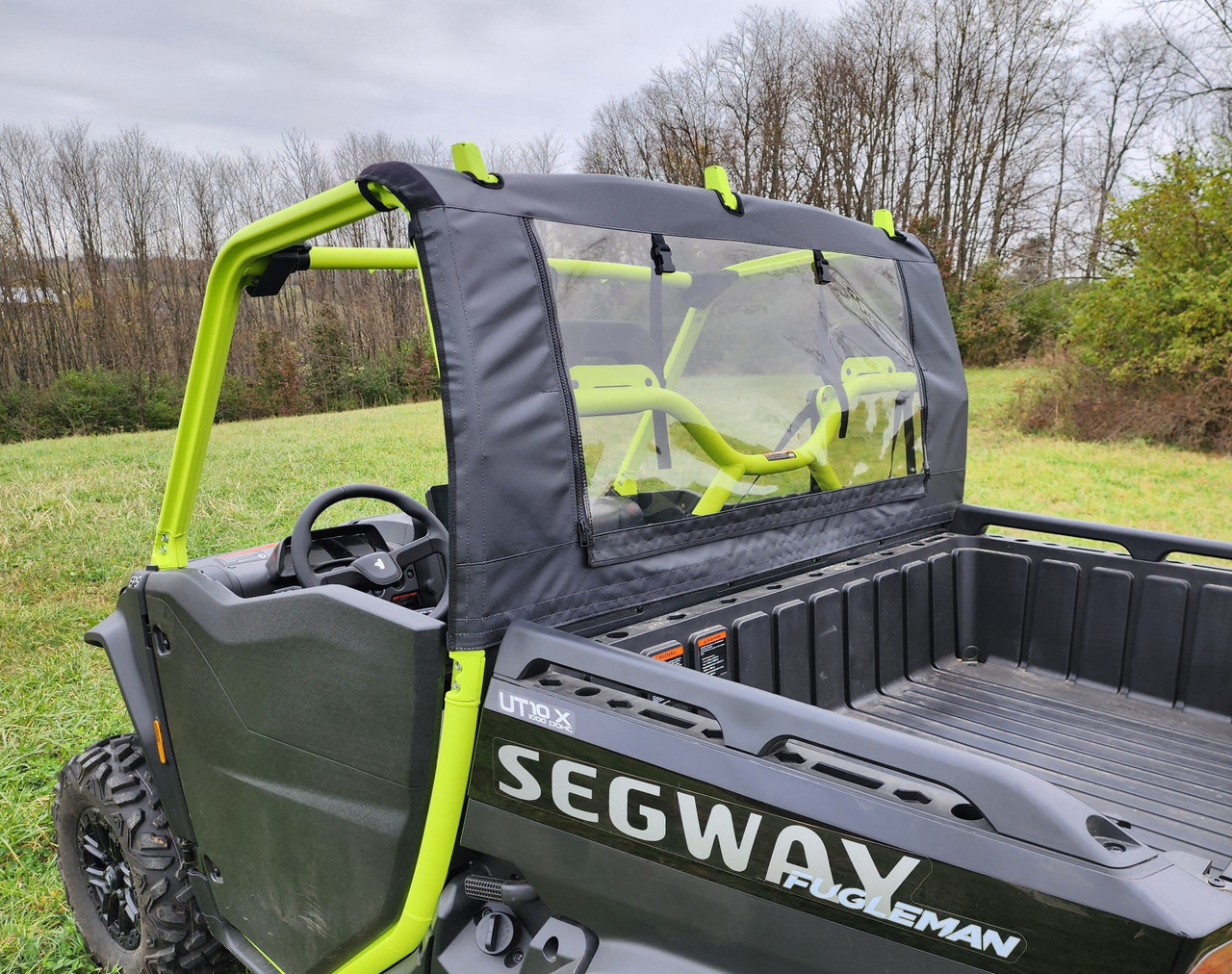 3 Star soft back panel on a black Segway UT10 with green cage, rear three-quarter view over the cargo bed