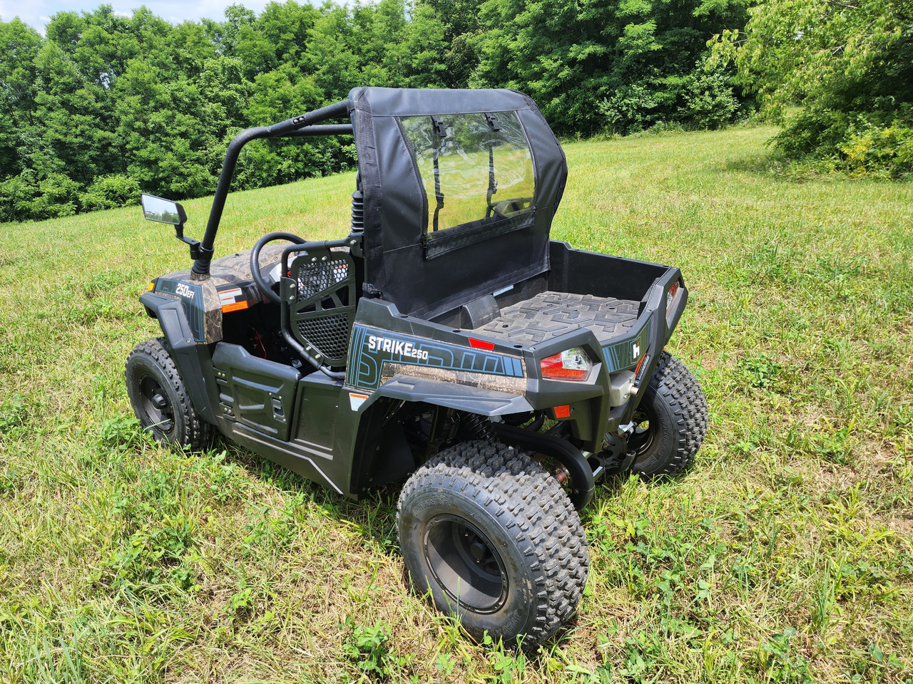 3 Star soft back panel with clear window behind the seats of a black HiSun Strike 250, rear three-quarter view