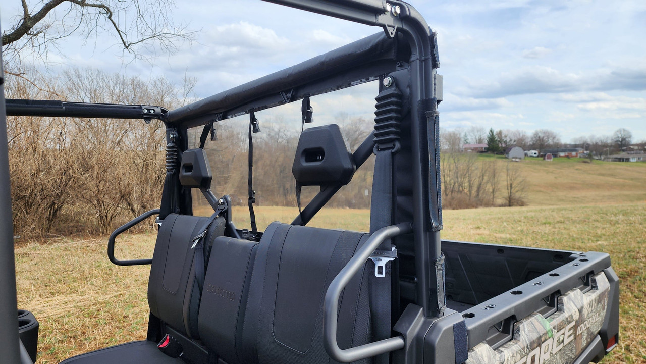 3 Star soft back panel seen from inside behind the rear seats of a camo CFMoto UForce 1000XL, clear window and cage