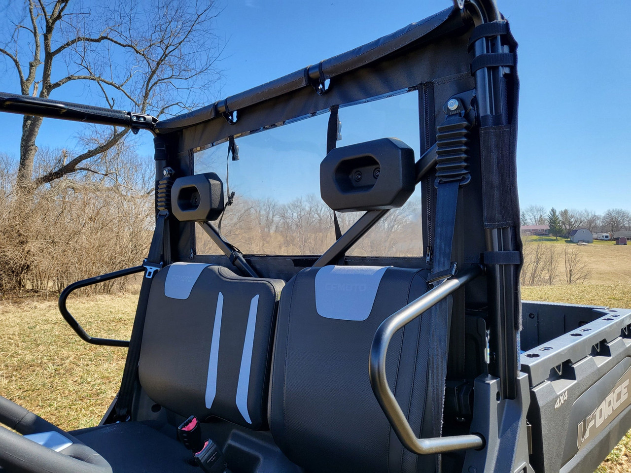 3 Star soft back panel with clear window behind the seats of a CFMoto UForce 600, seen from the bed