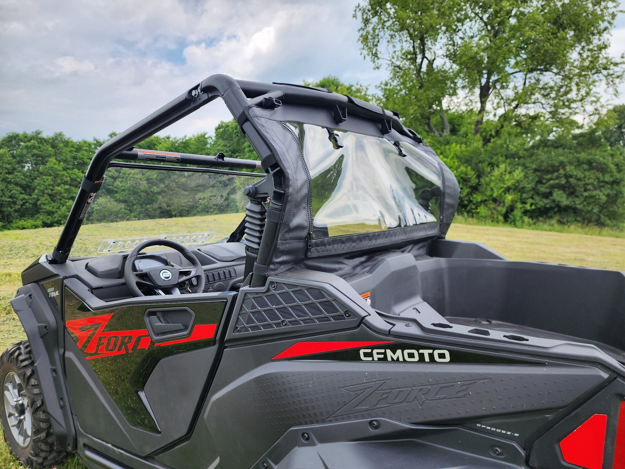 3 Star soft back panel on a black and red CFMoto ZForce 950, close driver side view showing the clear window