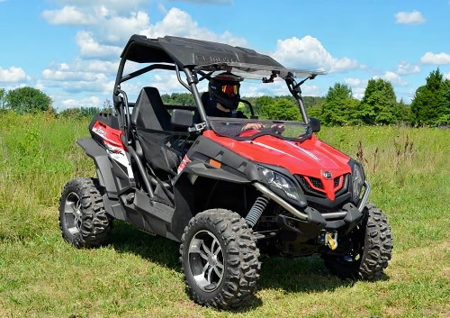 SuperATV flip out windshield on a red CF Moto ZForce 800 EX with the lower panel tilted open, front three-quarter view