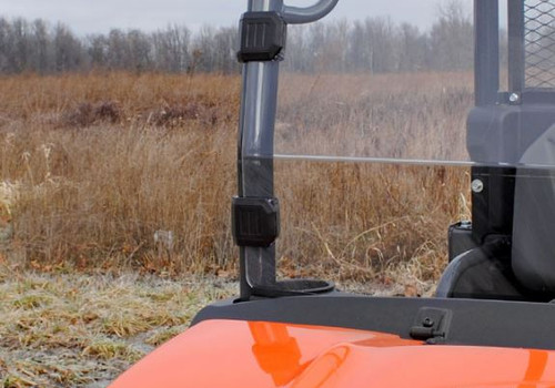 Close-up of the SuperATV full windshield clamp on the cage of an orange Kubota RTV X-900, edge view from the side