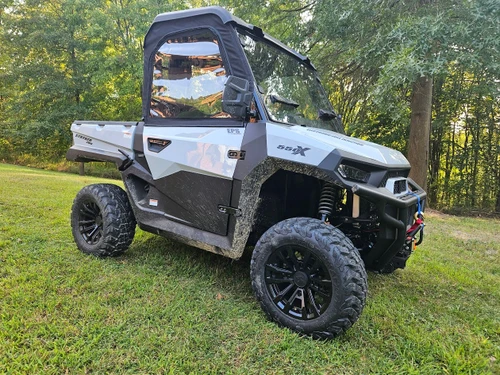 Side X Side soft doors and rear window on a white Hisun Stryker 550X, front three-quarter view in a yard