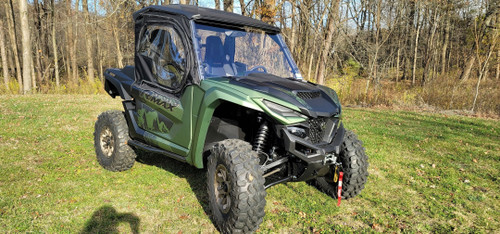 Side X Side full cab enclosure on a green Yamaha Wolverine RMAX2 with glass windshield, front corner view
