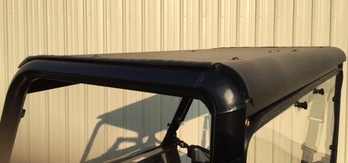 Extreme Metal Products black aluminum roof installed on the cage of a Polaris Ranger 500/570 Mid Size, side view