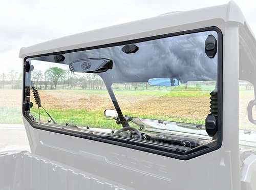 Spike rear windshield for Kawasaki Ridge: rear shield highlighted on a faded UTV cab, view from the bed