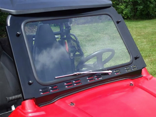 Extreme Metal Products glass windshield with manual wiper installed on a red Polaris RZR, front three-quarter view