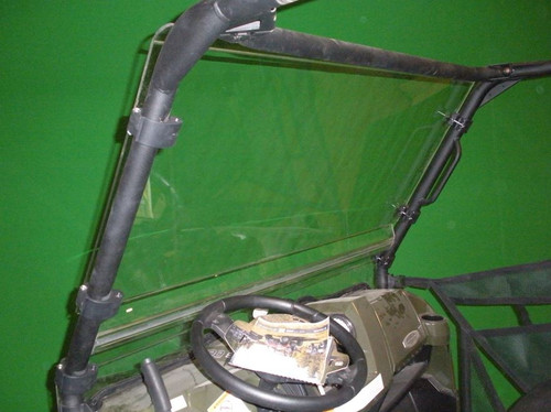 Side view of the Trail Armor Cool Flo windshield clamped to the Polaris Ranger cage with the dash below
