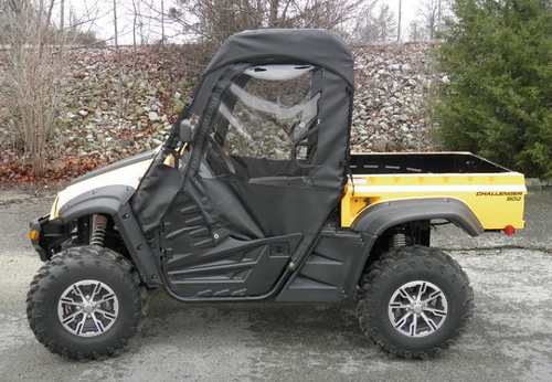 3 Star full cab enclosure with vinyl windshield on a yellow Cub Cadet Challenger 500, side profile view