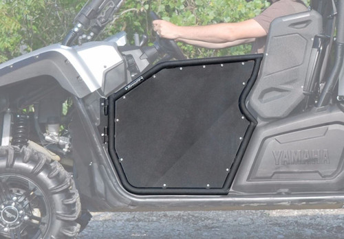 SuperATV aluminum half doors installed on a silver Yamaha Viking, driver side view with rider