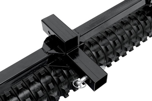 Close-up of the Moto Alliance Impact Implements culti-packer hitch receiver and pin above the roller