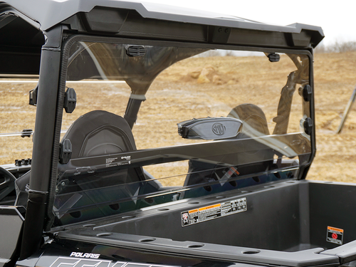 Rear three-quarter view of the Spike Powersports rear window over the Polaris General cargo bed showing the clamps