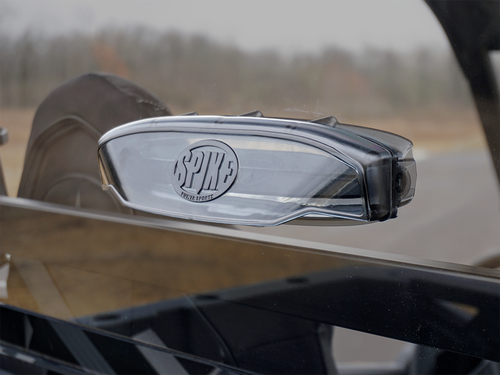 Close-up of the Spike Powersports badge on the tinted rear window panel of a Polaris General