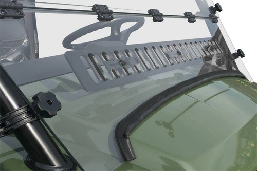 Close-up of the lower vent louver and cage clamp knob on the Spike Powersports windshield over the green Gator hood