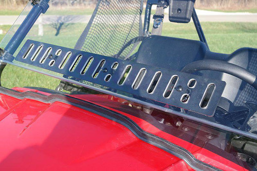 Close-up of the Spike Powersports windshield vent strip and lower seal on the red Honda Pioneer 500 hood