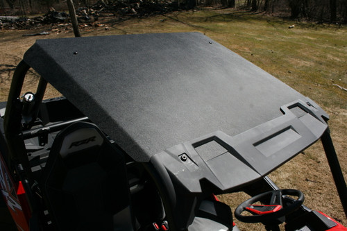 Spike Powersports black hard roof installed on a red Polaris RZR, viewed from above the cab