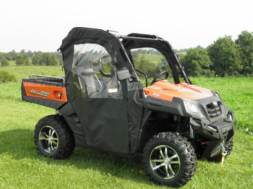 3 Star full cab enclosure with full doors on an orange CFMoto UForce, front three-quarter view in a field