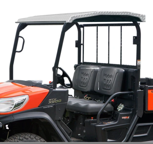 Wiedmann Bros diamond plate aluminum roof installed on an orange Kubota RTV X900, side view of the cab