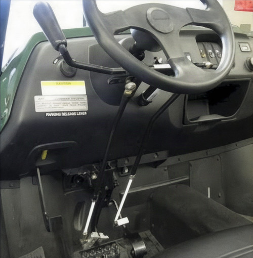 Sure Grip hand controls installed under the dash of an Arctic Cat Prowler, push-pull lever beside the steering wheel