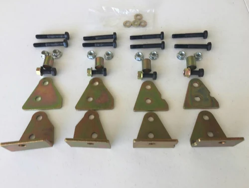 Wiedmann Bros 2 inch lift kit brackets, bolts and spacers for the Kubota RTV X-Series laid out on a table