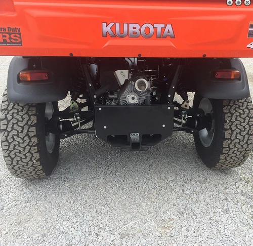 Rear view of an orange Kubota RTV X-Series showing the Wiedmann Bros 2 inch lift kit at the suspension